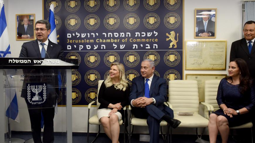 Honduran President Juan Orlando Hernandez (L) speaks during an inauguration ceremony in Jerusalem of the Diplomatic Trade Office of Honduras on September 1, 2019, in the presence of his wife First Lady Ana Garcia Carias (R), Israeli Prime Minister Benjamin Netanyahu (2nd-R) and his wife Sara Netanyahu (2nd-L). -  (Photo by DEBBIE HILL / POOL / AFP)        (Photo credit should read DEBBIE HILL/AFP via Getty Images)