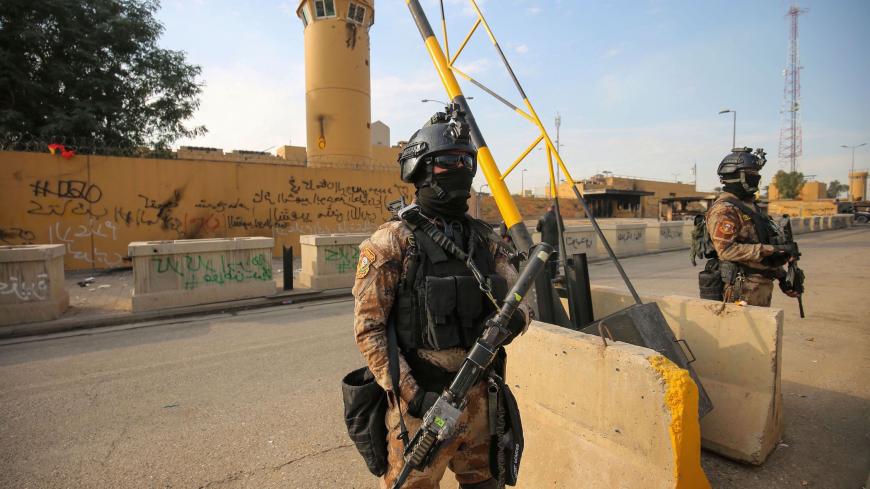 Iraqi counter-terrorism forces stand guard in front of the US embassy in the capital Baghdad on January 2, 2020. - The US embassy siege by pro-Iran protesters in Baghdad lasted just over a day, but analysts warn it could have lasting implications for Iraq's complex security sector and diplomatic ties. On Tuesday, hundreds of Hashed supporters stormed the high-security Green Zone and besieged the US embassy. The ease with which they breezed past US-trained forces demonstrated the Hashed's dominance in Iraq, 