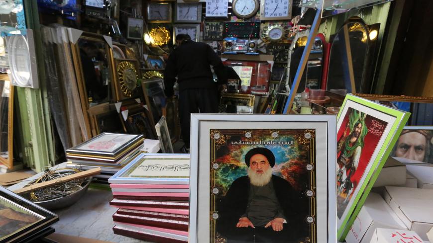 A picture of Iraq's top Shiite cleric Grand Ayatollah Ali Sistani is seen at a shop in a market in the capital Baghdad on January 18, 2020. (Photo by SABAH ARAR / AFP) (Photo by SABAH ARAR/AFP via Getty Images)