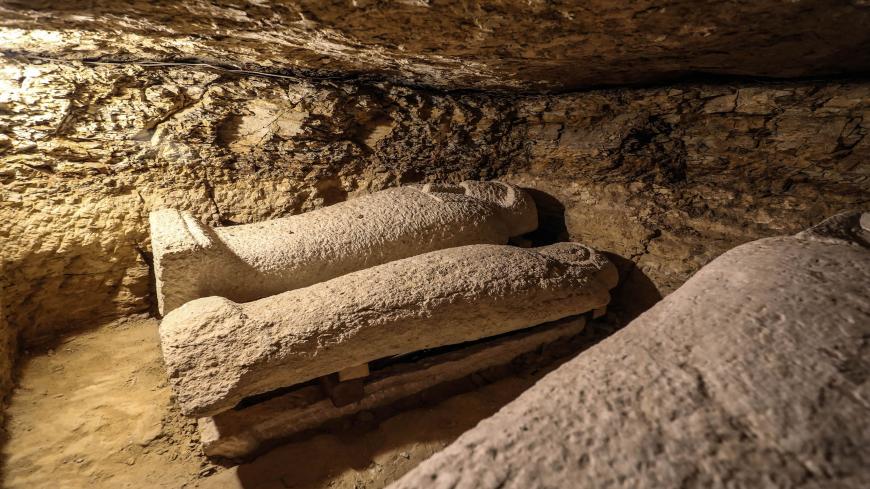 A picture taken on January 30, 2020, shows limestone sarcophagi discovered among many archeological finds in 3000-year-old communal tombs dedicated to high priests, in Al-Ghoreifa in Tuna al-Jabal in the Minya governorate. - Egypt's antiquities ministry unveiled 16 tombs of ancient high priests containing 20 sarcophagi, including one dedicated to the sky god Horus, discovered at the archaeological site, about 300 kilometres (186 miles) south of Cairo. The shared tombs were dedicated to high priests of the g
