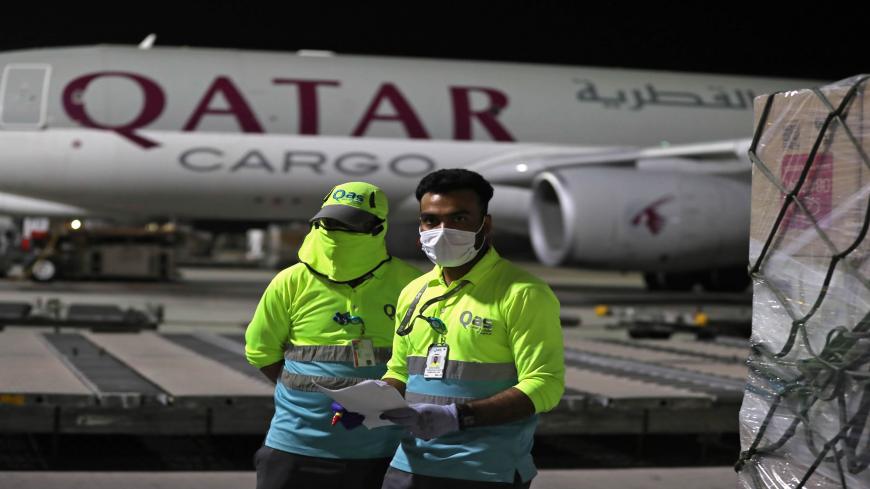 Supplies to tackle the coronavirus COVID-19 pandemic donated by the Qatar Fund for Development are loaded onto a Qatar Airways flight to Kigali in Rwanda at Doha's Hamad International Airport, on April 28, 2020. (Photo by KARIM JAAFAR / AFP) (Photo by KARIM JAAFAR/AFP via Getty Images)