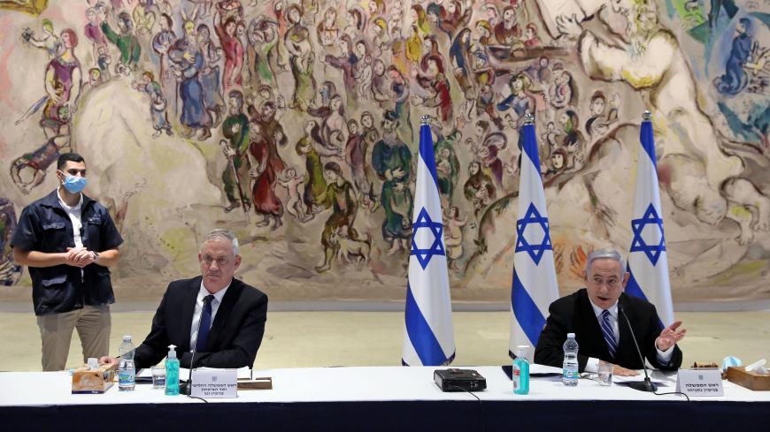 Israeli Prime Minister Benjamin Netanyahu (R) and Alternate Prime Minister and Defence Minister Benny Gantz (2nd-L) attend a cabinet meeting of the new government at Chagall State Hall in the Knesset (Israeli parliament) in Jerusalem on May 24, 2020. (Photo by ABIR SULTAN / POOL / AFP) (Photo by ABIR SULTAN/POOL/AFP via Getty Images)