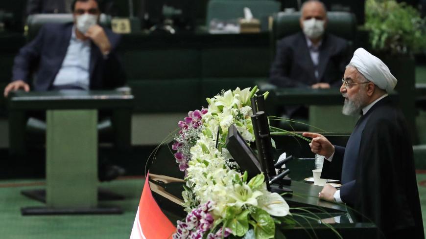 Iranian President Hassan Rouhani delivers a speech during the inaugural session of the new parliament following February elections, in Tehran on May 27, 2020. - The 11th legislature since the Islamic revolution of 1979 opened as the country's economy, which has been hard hit by the novel coronavirus, gradually returns to normal. Rouhani, who is in the final year of his second and final term, called on MPs, collectively and individually, to place the "national interest above special interests", "party intere
