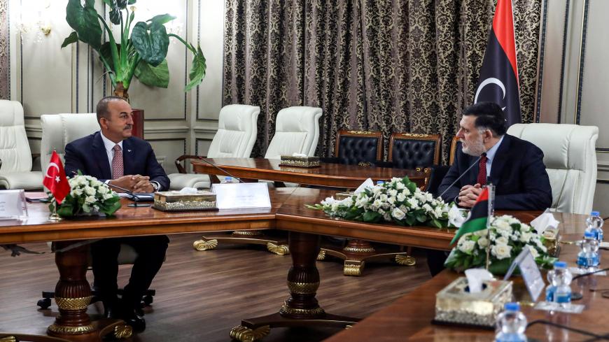 Prime Minister of Libya's UN-recognised Government of National Accord (GNA) Fayez al-Sarraj (R) meets with Turkey's Foreign Minister Mevlut Cavusoglu at the GNA's presidential headquarters in the capital Tripoli on June 17, 2020. (Photo by - / AFP) (Photo by -/AFP via Getty Images)