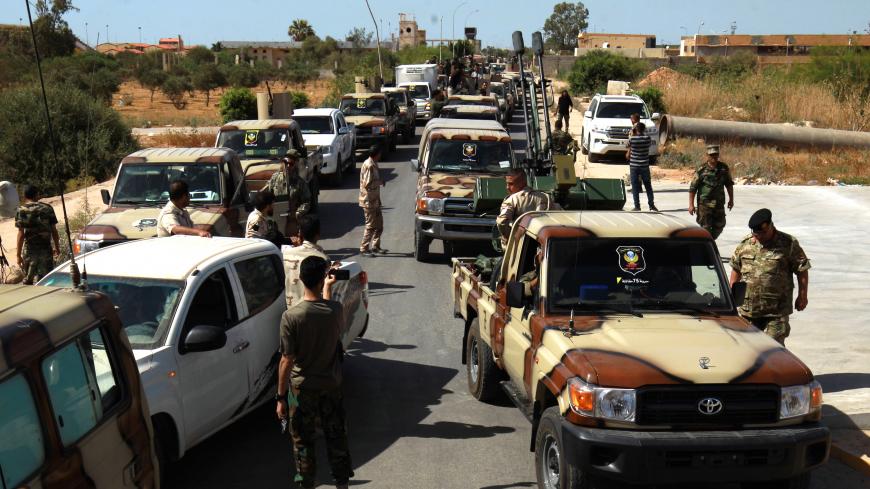 Members of the self-proclaimed eastern Libyan National Army (LNA) special forces gather in the city of Benghazi, on their way to reportedly back up fellow LNA fighters on the frontline west of the city of Sirte, facing forces loyal to the UN-recognised Government of National Accord (GNA), on June 18, 2020. - The resurgent GNA has vowed to push on for Sirte, late Libyan leader Moamer Kadhafi's hometown and the last major settlement before the traditional boundary between western Libya and strongman Khalifa H