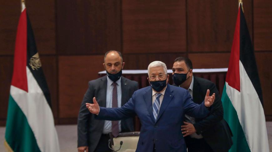 President Mahmoud Abbas (C) wears a protective mask as he attends a meeting of the Palestinian leadership to discuss the United Arab Emirates' deal with Israel to normalise relations, in Ramallah in the Israeli-occupied West Bank, on August 18, 2020. (Photo by MOHAMAD TOROKMAN / POOL / AFP) (Photo by MOHAMAD TOROKMAN/POOL/AFP via Getty Images)