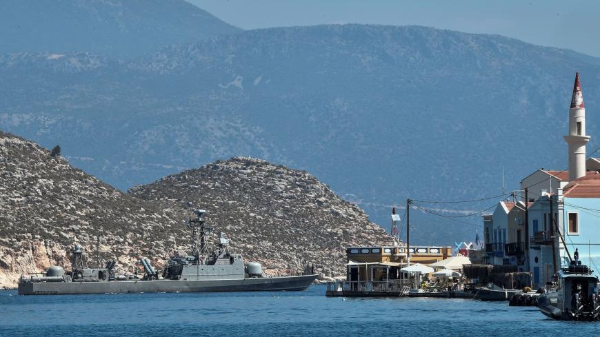 A Greek navy boat leaves the port of the tiny Greek island of Kastellorizo, officially Megisti, the most south-eastern inhabited Greek island in the Dodecanese, situated two kilometers off the south coast of Turkey on August 28, 2020. (Photo by Louisa GOULIAMAKI / AFP) (Photo by LOUISA GOULIAMAKI/AFP via Getty Images)