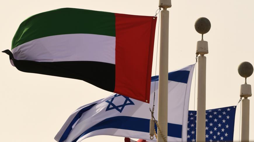 The Emirati, Israeli and US flags sway in the wind at the Abu Dhabi airport on August 31, 2020, in the first-ever commercial flight from Israel to the UAE. - A US-Israeli delegation including White House advisor Jared Kushner took off on a historic first direct commercial flight from Tel Aviv to Abu Dhabi to mark the normalisation of ties between the Jewish state and the UAE. (Photo by Karim SAHIB / AFP) (Photo by KARIM SAHIB/AFP via Getty Images)