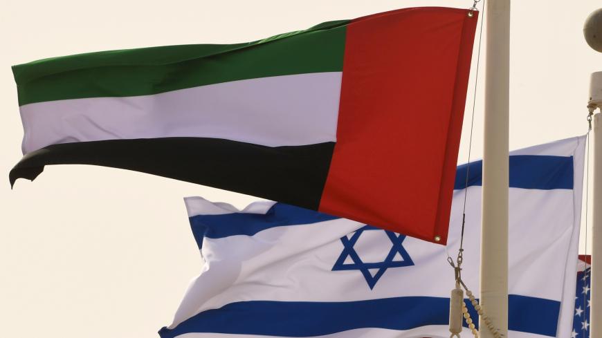 The Emirati, Israeli and US flags sway in the wind at the Abu Dhabi airport at the arrival  of the first-ever commercial flight from Israel to the UAE, on August 31, 2020. - A US-Israeli delegation including White House advisor Jared Kushner took off on a historic first direct commercial flight from Tel Aviv to Abu Dhabi to mark the normalisation of ties between the Jewish state and the UAE. (Photo by KARIM SAHIB / AFP) (Photo by KARIM SAHIB/AFP via Getty Images)
