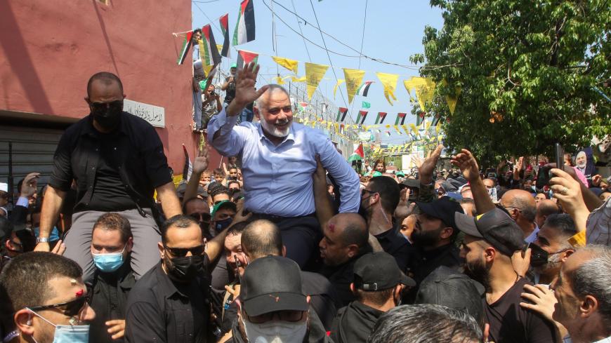 Hamas' political bureau chief Ismail Haniyeh greets supporters during a visit to the Ain el-Helweh camp, Lebanon's largest Palestinian refugee camp, near the southern coastal city of Sidon on September 6, 2020. (Photo by Mahmoud ZAYYAT / AFP) (Photo by MAHMOUD ZAYYAT/AFP via Getty Images)
