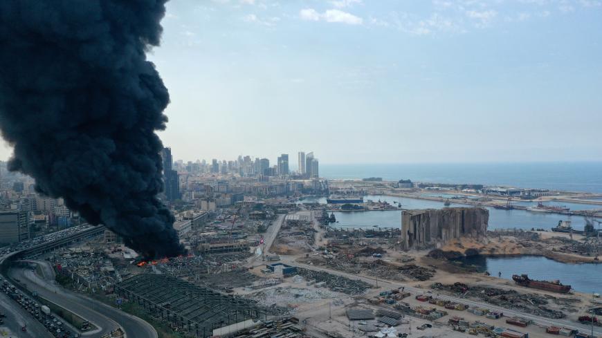 BEIRUT, LEBANON - SEPTEMBER 10: An aerial view of the black smoke following a fire that erupted in Beirut Port’s Free Zone on September 10, 2020 in Beirut, Lebanon. The fire broke out in a structure in the city's heavily damaged port facility, the site of last month's explosion that killed more than 190 people. (Photo by Haytham Al Achkar/Getty Images)
