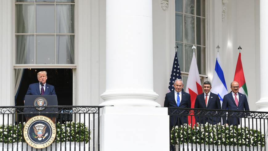 TOPSHOT - (L-R)US President Donald Trump speaks as Israeli Prime Minister Benjamin Netanyahu,UAE Foreign Minister Abdullah bin Zayed Al-Nahyan and Bahrain Foreign Minister Abdullatif al-Zayani listen before they participate in the signing of the Abraham Accords where the countries of Bahrain and the United Arab Emirates recognize Israel, on the South Lawn of the White House in Washington, DC, September 15, 2020. - Israeli Prime Minister Benjamin Netanyahu and the foreign ministers of Bahrain and the United 