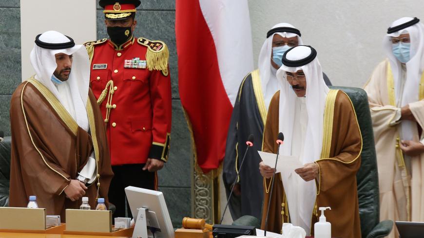 Sheikh Nawaf al-Ahmad Al-Sabah (2-R) reads a statement asfter being sworn in as Kuwait's new Emir at the National Assembly in Kuwait City, as Parilament Speaker Marzouq al-Ghanem (L) looks on, on September 30, 2020. - Kuwait today swore in its new emir, Sheikh Nawaf al-Ahmad Al-Sabah, after the death of his half-brother, Sheikh Sabah, who died in the US at the age of 91. (Photo by Yasser Al-Zayyat / AFP) (Photo by YASSER AL-ZAYYAT/AFP via Getty Images)