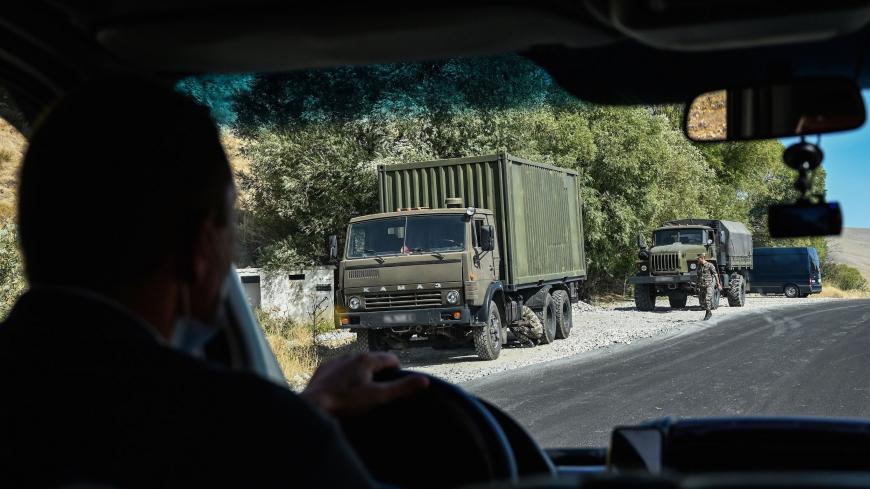Military trucks are seen on the side of a road near the village of Zangakatun in Armenia on September 30, 2020. - Armenia and Azerbaijan rejected international calls for  negotiations and a halt to fighting as fierce clashes over the disputed region of Nagorny Karabakh spilled over into a fourth day on September 30. (Photo by - / AFP) (Photo by -/AFP via Getty Images)