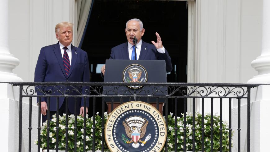 WASHINGTON, DC - SEPTEMBER 15: Prime Minister of Israel Benjamin Netanyahu speaks as U.S. President Donald Trump looks on during the signing ceremony of the Abraham Accords on the South Lawn of the White House September 15, 2020 in Washington, DC. Witnessed by President Trump, Prime Minister Netanyahu signed a peace deal with the UAE and a declaration of intent to make peace with Bahrain. (Photo by Alex Wong/Getty Images)
