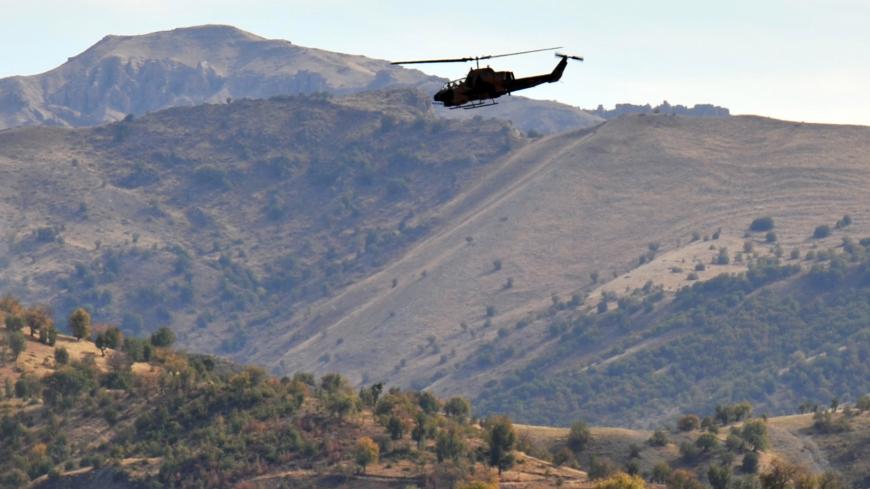 A photograph taken on October 22, 2011 shows a Turkish military helicopter flying over a mountain in Yemisli, in the Hakkari province, near the Iraqi border in southeastern Turkey.  Turkish air strikes killed 23 Kurdish villagers in the southeast near the Iraqi border early on December 29, 2011 an official of the pro-Kurdish Peace and Democracy Party (BDP) said. Provincial officials found 23 bodies at Ortasu village in Sirnak province, councillor Ertan Eris told pro-Kurdish Roj TV from the bombing site. Nin