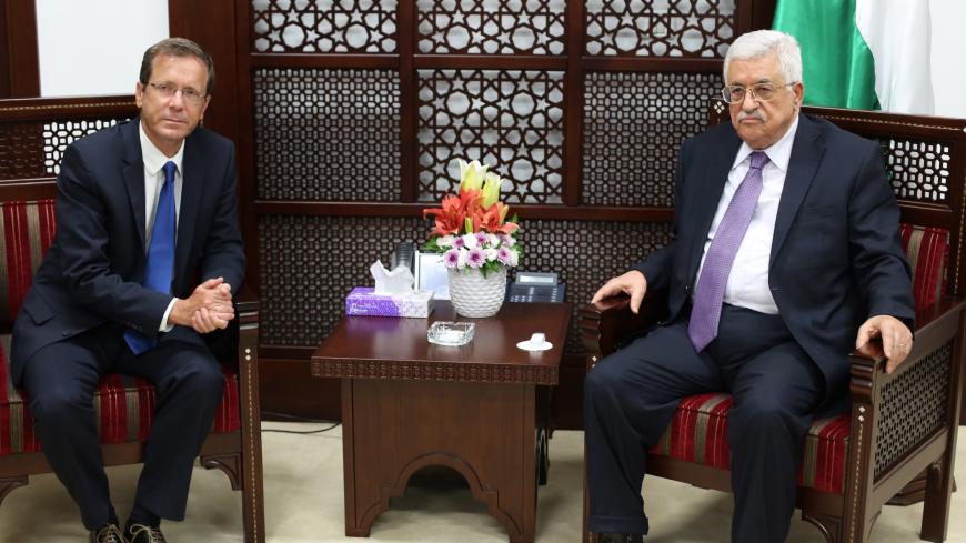 Israeli co-leader of the Zionist Union party and Labour Party's leader Isaac Herzog (L) meets with Palestinian Authority President Mahmud Abbas in the West Bank city of Ramallah on August 18, 2015.  AFP PHOTO/ABBAS MOMANI        (Photo credit should read ABBAS MOMANI/AFP via Getty Images)