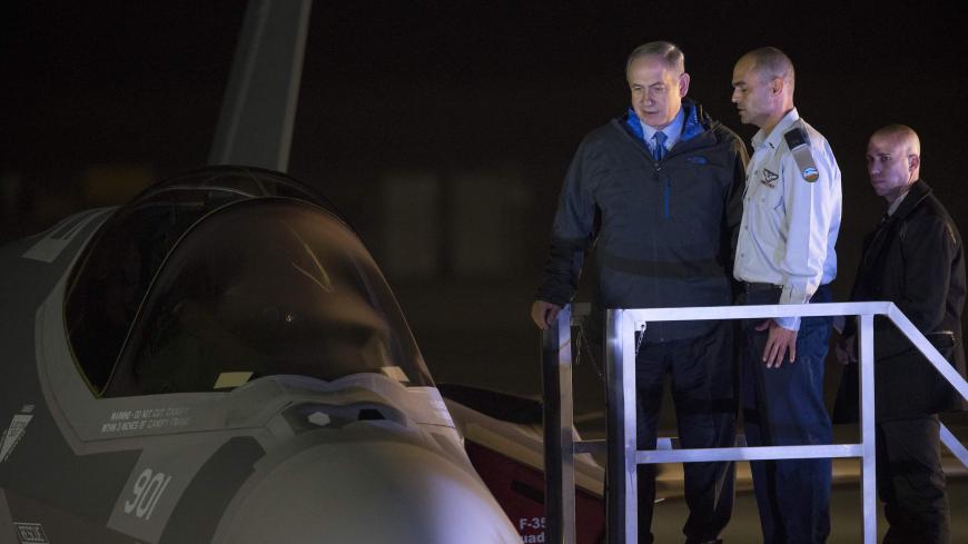 Israeli Prime Minister Benjamin Netanyahu (3rdR) look at one of the first two F-35 stealth fighter jets purchased in the United States next to its pilot (2ndR), an Israeli officer, after he landed on December 12, 2016 at the Israeli Nevatim Air force base in the Negev desert, near the southern city of Beersheva.
The first two US F-35 stealth fighters bought by Israel landed at an air base in the Jewish state this evening, an AFP journalist at the site said. Their arrival, hailed as a gamechanger by Israeli 