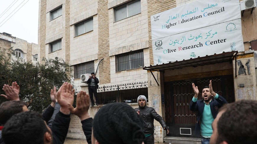 Syrian university students protest in the city of Idlib on February 9, 2019 after jihadists of the Hayat Tahrir al-Sham organisation closed many private education centres in the north-western Syrian province of Idlib. - The Idlib region is mainly controlled by the jihadists of Hayat Tahrir al-Sham, a Syrian group led by former Al-Qaeda fighters, after they pushed back smaller, Turkey-backed rebel outfits last month. (Photo by OMAR HAJ KADOUR / AFP)        (Photo credit should read OMAR HAJ KADOUR/AFP via Ge
