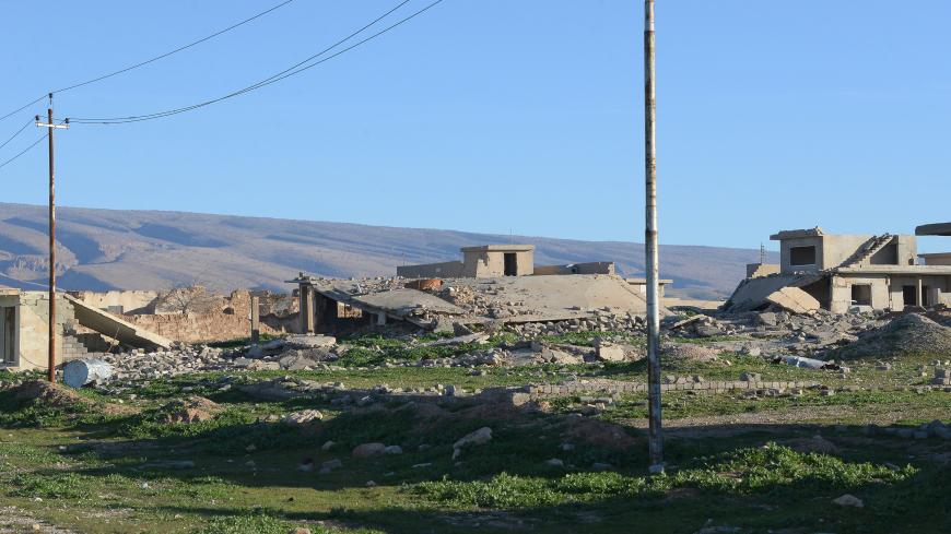 A picture taken on February 5, 2019, shows a general view of the damaged buildings in the northern Iraqi town of Sinjar. - For decades in the mountainous region of Sinjar in Iraq's diverse north, the lives of many revolved around their lands, but now many Sunni Arab farmers are estranged from their fields out of fear of reprisal attacks. The region, which borders Syria is home to an array of communities -- Shiite and Sunni Arabs, Kurds, and Yazidis -- which formed a patchwork that was ripped apart when the 