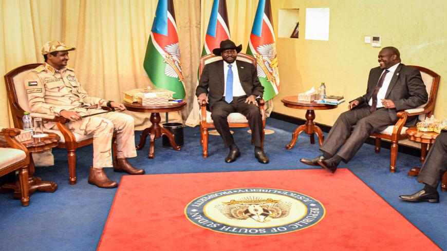 South Sudanese President Salva Kiir (C), South Sudan's opposition leader Riek Machar (R) and Sudan's deputy head of the Transitional Military Council Mohamed Hamdan Daglo "Hemeti" sit after their peace agreement meeting at the State House in Juba, South Sudan, on December 16, 2019. (Photo by Majak Kuany / AFP) (Photo by MAJAK KUANY/AFP via Getty Images)