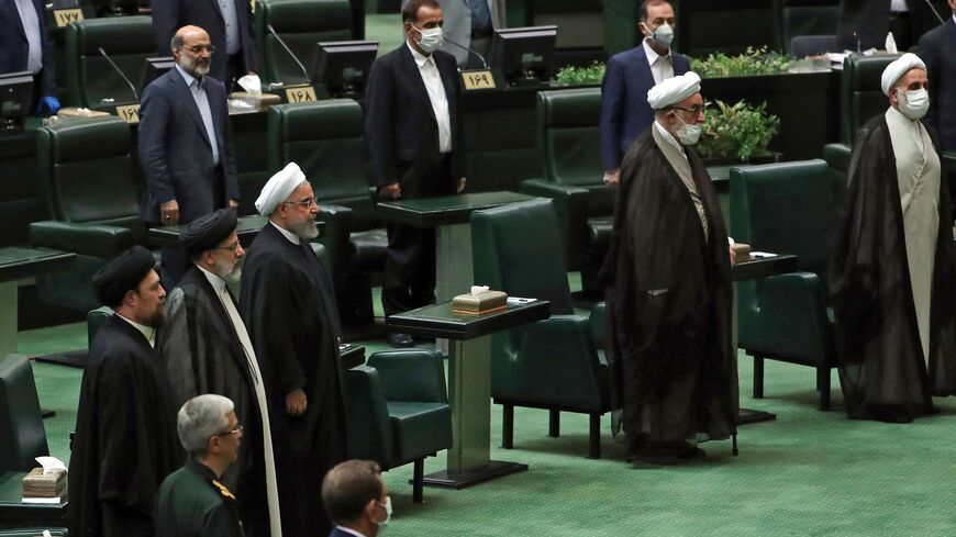 Iranian President Hassan Rouhani attends the inaugural session of the new parliament in Tehran on May 27, 2020, following February elections. - The 11th legislature since the Islamic revolution of 1979 opened as the country's economy, which has been hard hit by the novel coronavirus, gradually returns to normal. Rouhani, who is in the final year of his second and final term, called on MPs, collectively and individually, to place the "national interest above special interests", "party interests" or "constitu