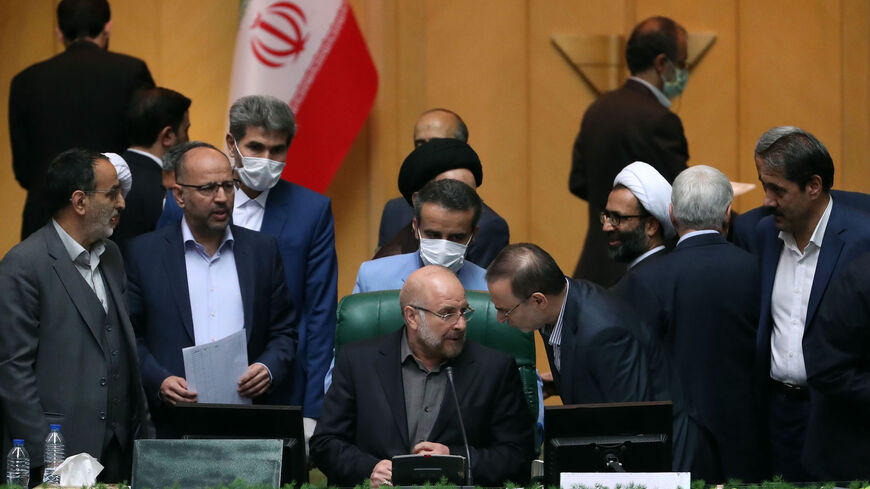 Iranian Mohamad Bagher Ghalibaf (C) sits among members of the parliament after being elected as parliament speaker at the Iranian parliament in Tehran on May 28, 2020. - Iran's newly formed parliament elected the former Tehran mayor Ghalibaf as its speaker, consolidating the power of conservatives ahead of next year's presidential election. State television said the 58-year-old received 230 votes out of the 267 cast to secure the post, one of the most influential positions in the Islamic republic. (Photo by