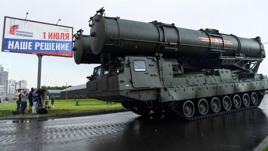 A Russian S400b4 anti-aircraft rocket system roll past during the second night of rehearsals in preparation for the WWII Victory Parade in front of a banner informing of a national vote on constitutional changes in Moscow on June 18, 2020. - Russia's President Putin on June 24 will preside over a massive military parade to mark Soviet victory in World War II, which was postponed due to the coronavirus pandemic. The banner read as "Our decision". (Photo by Kirill KUDRYAVTSEV / AFP) (Photo by KIRILL KUDRYAVTS