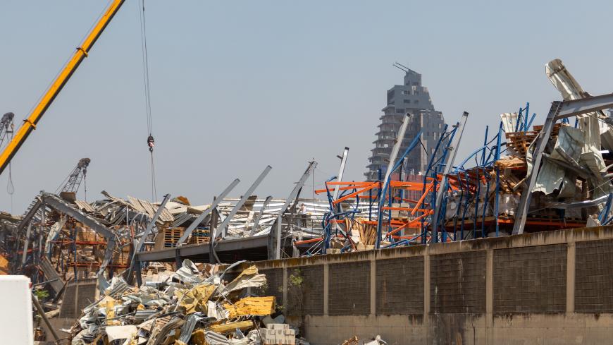BEIRUT, LEBANON - SEPTEMBER 08: Workers continue to remove debris, damaged cars, and destroyed warehouses from last month's explosion at the Port’s Free Zone on September 8, 2020 in Beirut, Lebanon. Lebanon's army says they have found more than four tonnes of ammonium nitrate near the port entrance, the same substance that caused the August 4 blast. Last month's explosion at Beirut's port killed over 200 people, injured thousands, and upended countless lives. (Photo by Haytham Al Achkar/Getty Images)
