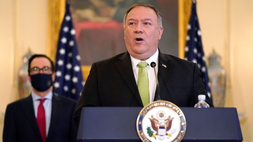 US Secretary of State Mike Pompeo speaks during a news conference to announce the Trump administration's restoration of sanctions on Iran, on September 21, 2020, at the US State Department in Washington,DC, as US Treasury Secretary Steve Mnuchin looks on. - The United States said Monday it was imposing sanctions on Iran's defense ministry and Venezuelan President Nicolas Maduro under a UN authority which is widely contested. "For nearly two years corrupt officials in Tehran have worked with the illegitimate