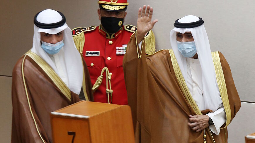 Sheikh Nawaf al-Ahmad Al-Sabah (R) salutes the crowd after being sworn in as Kuwait's new Emir at the National Assembly in Kuwait City, as Parilament Speaker Marzouq al-Ghanem looks on, on September 30, 2020. - Kuwait today swore in its new emir, Sheikh Nawaf al-Ahmad Al-Sabah, after the death of his half-brother, Sheikh Sabah, who died in the US at the age of 91. (Photo by Yasser Al-Zayyat / AFP) (Photo by YASSER AL-ZAYYAT/AFP via Getty Images)
