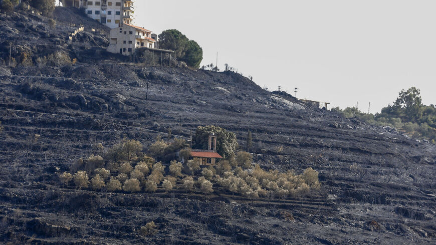 TOPSHOT - A picture taken on October 11, 2020, shows a church in the middle of a scorched hillside due to forest fires in the countryside of the Syrian western city of Tartus. - Dozens of fires that ravaged parts of Syria and Lebanon in recent days were brought under control, authorities in the two countries said. (Photo by LOUAI BESHARA / AFP) (Photo by LOUAI BESHARA/AFP via Getty Images)