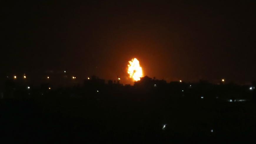 TOPSHOT - Flames are seen following an Israeli air strike in the town of Khan Yunis, in the southern Gaza Strip, early on October 23, 2020. - The Israeli army said two rockets were fired from Gaza towards Israel on the night of October 22, without causing any casualties or damage, and that one had been intercepted by air defences. (Photo by SAID KHATIB / AFP) (Photo by SAID KHATIB/AFP via Getty Images)