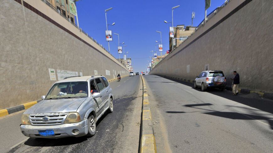 A car passes by the site of the attack against Hassan Zaid, minister for youth and sports in Yemen's rebel Huthi administration, where he was shot dead by unidentified gunmen, in the Huthi-held capital Sanaa on October 27, 2020. - Unidentified gunmen shot the Huthi government minister as he drove his car, also wounding his daughter. Yemen is mired in civil war between Iran-backed Huthi rebels -- who control the capital but whose administration is not internationally recognised -- and a beleaguered governmen