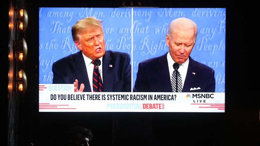 WEST HOLLYWOOD, CALIFORNIA - SEPTEMBER 29: A broadcast of the first debate between President Donald Trump and Democratic presidential nominee Joe Biden is played on a TV at The Abbey, which seated patrons at socially distanced outdoor tables, on September 29, 2020 in West Hollywood, California. The debate being held in Cleveland, Ohio is the first of three scheduled debates between Trump and Biden. (Photo by Mario Tama/Getty Images)