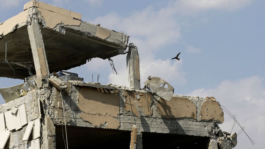 This picture taken on April 14, 2018 shows the wreckage of a building described as part of the Scientific Studies and Research Centre (SSRC) compound in the Barzeh district, north of Damascus, during a press tour organised by the Syrian information ministry.
The United States, Britain and France launched strikes against Syrian President Bashar al-Assad's regime early on April 14 in response to an alleged chemical weapons attack after mulling military action for nearly a week. Syrian state news agency SANA r