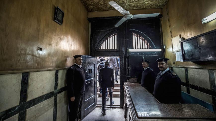 A picture taken during a guided tour organised by Egypt's State Information Service on February 11, 2020, shows Egyptian policemen at the entrance of the Tora prison in the Egyptian capital Cairo. (Photo by Khaled DESOUKI / AFP) (Photo by KHALED DESOUKI/AFP via Getty Images)