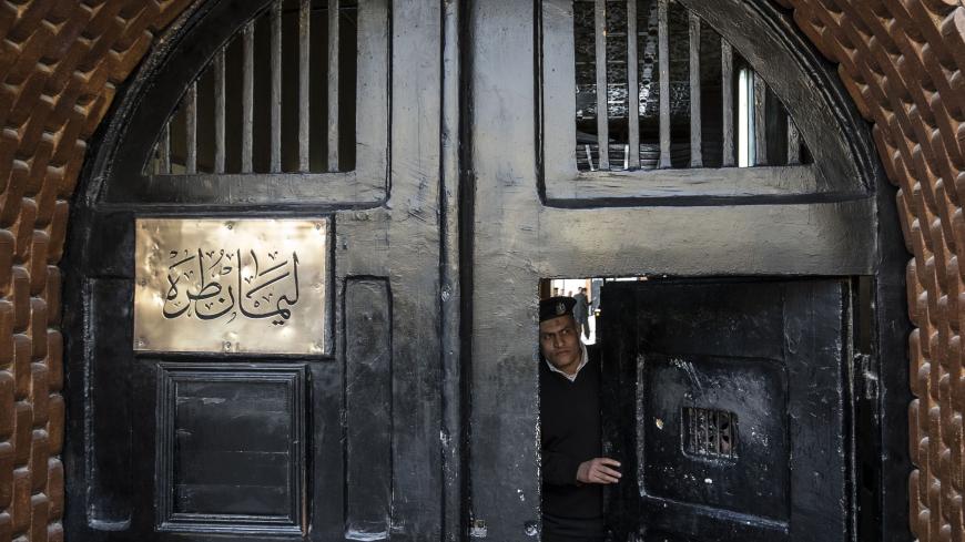 A picture taken during a guided tour organised by Egypt's State Information Service on February 11, 2020, shows an Egyptian police officer at the entrance of the Tora prison in the Egyptian capital Cairo. (Photo by Khaled DESOUKI / AFP) (Photo by KHALED DESOUKI/AFP via Getty Images)