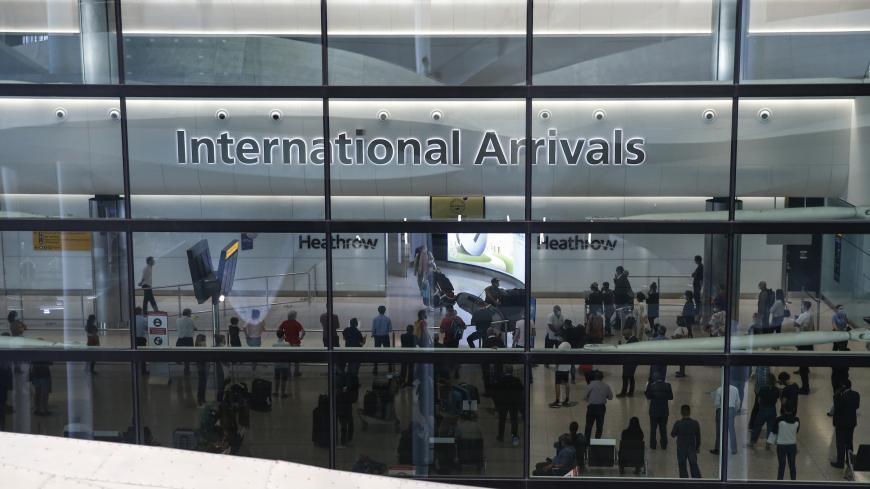 LONDON, ENGLAND - AUGUST 22: Travellers exit via the International Arrival gate at Heathrow Airport Terminal 2 on August 22, 2020 in London, England. As of Saturday morning at 4am, travellers arriving in England from Austria, Croatia, and Trinidad and Tobago were required to quarantine themselves for 14 days. At the same time, travellers from Portugal were no longer required to quarantine. (Photo by Hollie Adams/Getty Images)