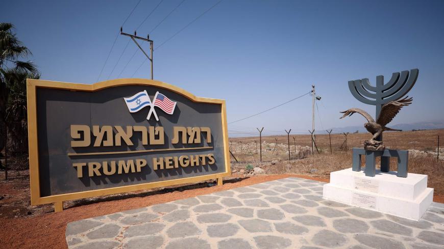An eagle statue is seen placed on a Menorah sculpture donated by the Jewish American Society for Historic Preservation (JASHP) dedicated to US President Donald Trump by the entrance to Trump Heights, an Israeli settlement in the Israeli-occupied Golan Heights on September 21, 2020. - Twenty Jewish families are due to move to the remote spot by the end of November, with the aim of 20 families arriving each year for the next decade. Trump Heights, or "Ramat Trump" in Hebrew, was inaugurated in June 2019 by Pr