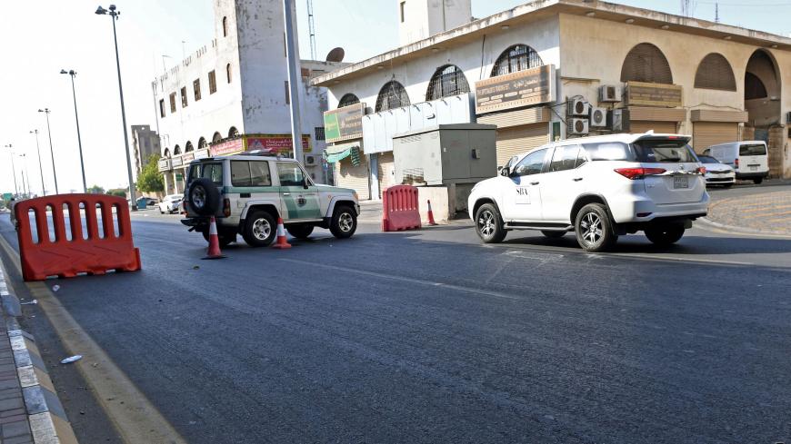 Saudi police close a street leading to a non-Muslim cemetery in the Saudi city of Jeddah where a bomb struck a World War I commemoration attended by European diplomats on November 11, 2020 leaving several people wounded amid Muslim anger over French cartoons. - The attack is the second assault in the kingdom in less than a month, as French President Emmanuel Macron has sought to assuage anger across Muslim nations over satirical cartoons of the Prophet Mohammed. (Photo by - / AFP) (Photo by -/AFP via Getty 