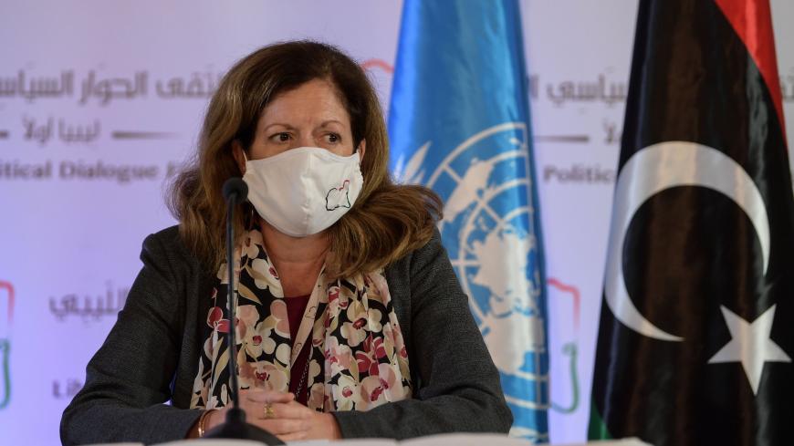 UN acting envoy to Libya Stephanie Williams wears a protective mask before giving a press conference in the Tunisian capital Tunis on November 11, 2020, following 2 days of talks, hosted by the UN on the Libyan conflict. - The delegates "reached a preliminary roadmap for ending the transitional period and organising free, fair, inclusive and credible presidential and parliamentary elections,"  Williams told journalists.
After years of conflict sparked by a 2011 NATO-backed uprising, Libya has two rival admi