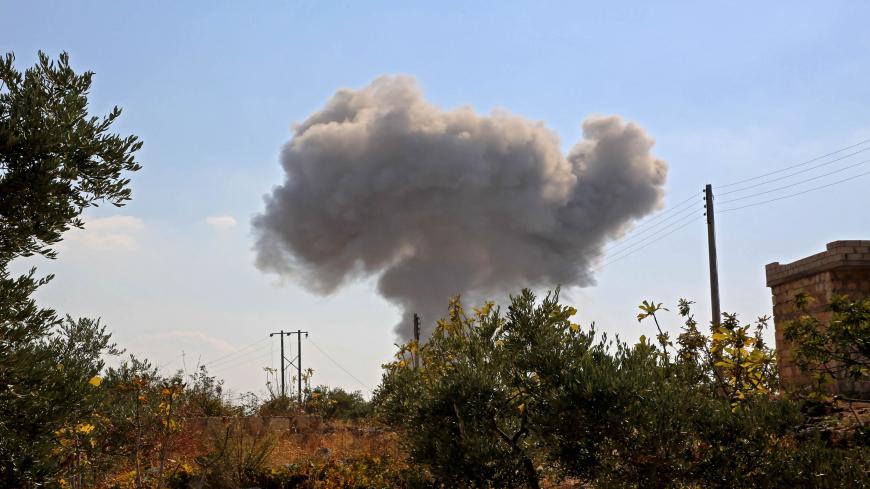 Smoke rises during a reported air strike by Russian forces targetting the outskirts of the town of Al-Bara, in the southern countryside of the rebel-held Idlib province, on November 13, 2020. (Photo by Mohammed AL-RIFAI / AFP) (Photo by MOHAMMED AL-RIFAI/AFP via Getty Images)