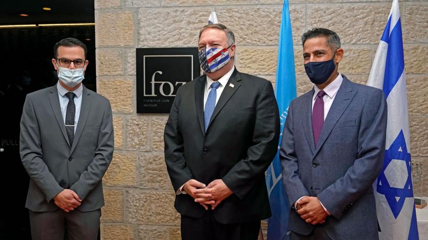 US Secretary of State Mike Pompeo (C) poses for a photo with Daniel Voiczek (L), general manager and CEO of the Friends of Zion Museum, and Nir Kimhi, the museum founders representative in Israel, arrives for a tour of the Friends of Zion Museum on  November 20, 2020, in Jerusalem. - US Secretary of State Mike Pompeo became the first top American diplomat to visit a West Bank Jewish settlement and the Golan Heights, cementing Donald Trump's strongly pro-Israel legacy. (Photo by Patrick Semansky / POOL / AFP