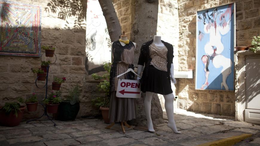 TEL AVIV, ISRAEL - OCTOBER 09:  (ISRAEL OUT)  Mannequins are seen at the entrance to a clothing store on October 09, 2013 in Jaffa, a suburb of Tel Aviv, Israel.  (Photo by Lior Mizrahi/Getty Images)