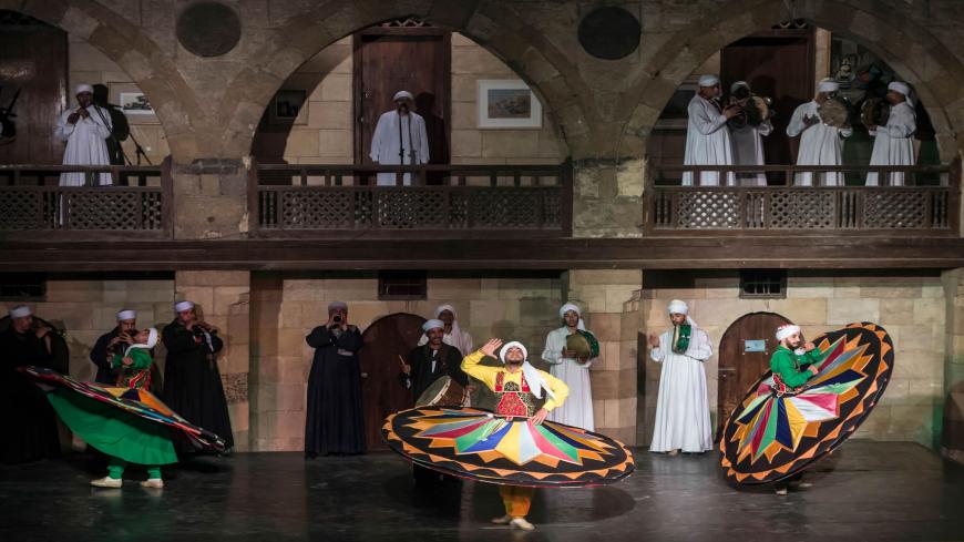Egyptian dancers perform the Tanoura during the holy fasting month of Ramadan, at el-Ghuri culture Palace in Cairo on May 22, 2018. (Photo by KHALED DESOUKI / AFP)        (Photo credit should read KHALED DESOUKI/AFP via Getty Images)