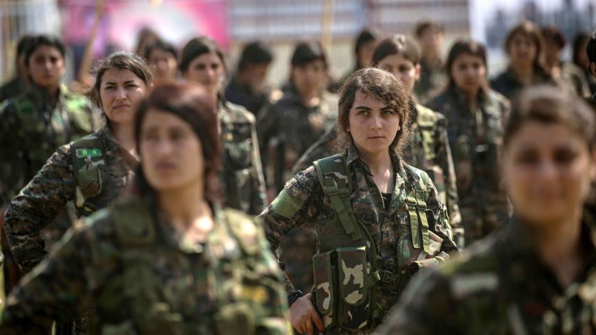 Fighters from the Kurdish Women's Protection units (YPJ) participate in a military parade on March 27, 2019, celebrating the total elimination of the Islamic State (IS) group's last bastion in eastern Syria, in the northwestern city of Hasakah, in the province of the same name. (Photo by Delil SOULEIMAN / AFP)        (Photo credit should read DELIL SOULEIMAN/AFP via Getty Images)