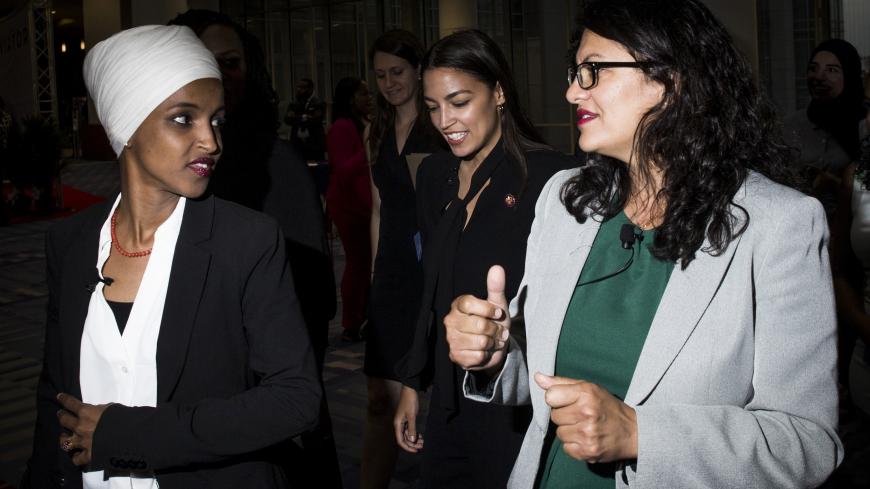 WASHINGTON, DC - SEPTEMBER 11: Rep. Ilhan Omar (D-MN), Rep. Alexandria Ocasio-Cortez (D-NY, and Rep. Rashida Tlaib (D-MI) arrive before participating during a town hall hosted by the NAACP on September 11, 2019 in Washington, DC. Also pictured is CNN Commentator Angela Rye.  (Photo by Zach Gibson/Getty Images)
