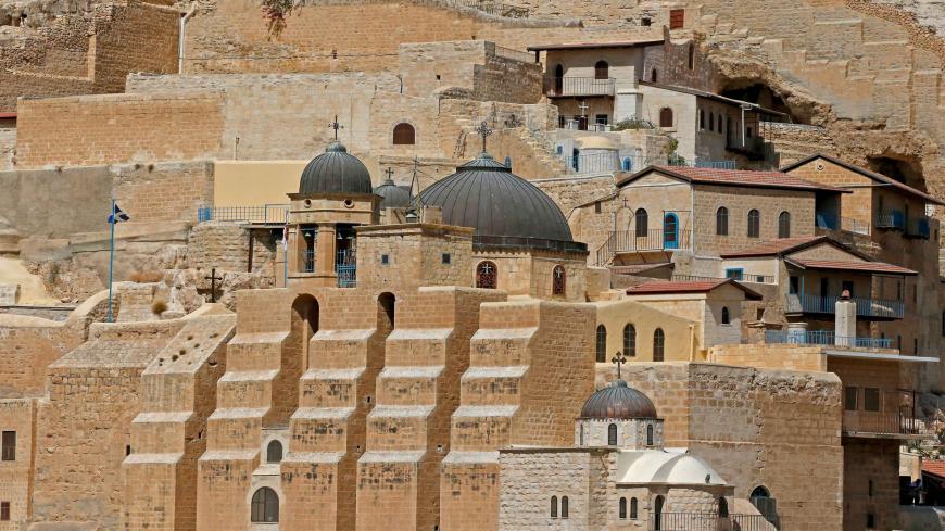 A picture taken on September 28, 2019 shows the Greek Orthodox monastery of St Sabbas, also known as Mar Saba, overlooking the Kidron Valley in the West Bank south of the biblical town of Bethlehem. (Photo by HAZEM BADER / AFP)        (Photo credit should read HAZEM BADER/AFP via Getty Images)