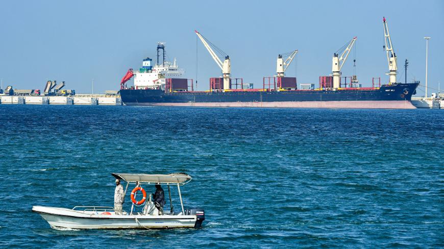 This picture taken on December 11, 2019, shows a Saudi security boat patrolling by an oil tanker at the port of Ras al-Khair, about 185 kilometres north of Dammam in Saudi Arabia's eastern province overlooking the Gulf. (Photo by GIUSEPPE CACACE / AFP) (Photo by GIUSEPPE CACACE/AFP via Getty Images)